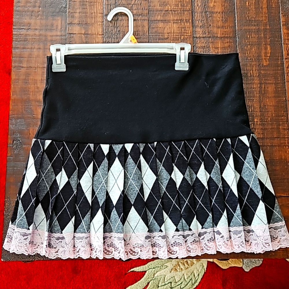 Very Cute Mini Pleated Skirt with Lace hemline.